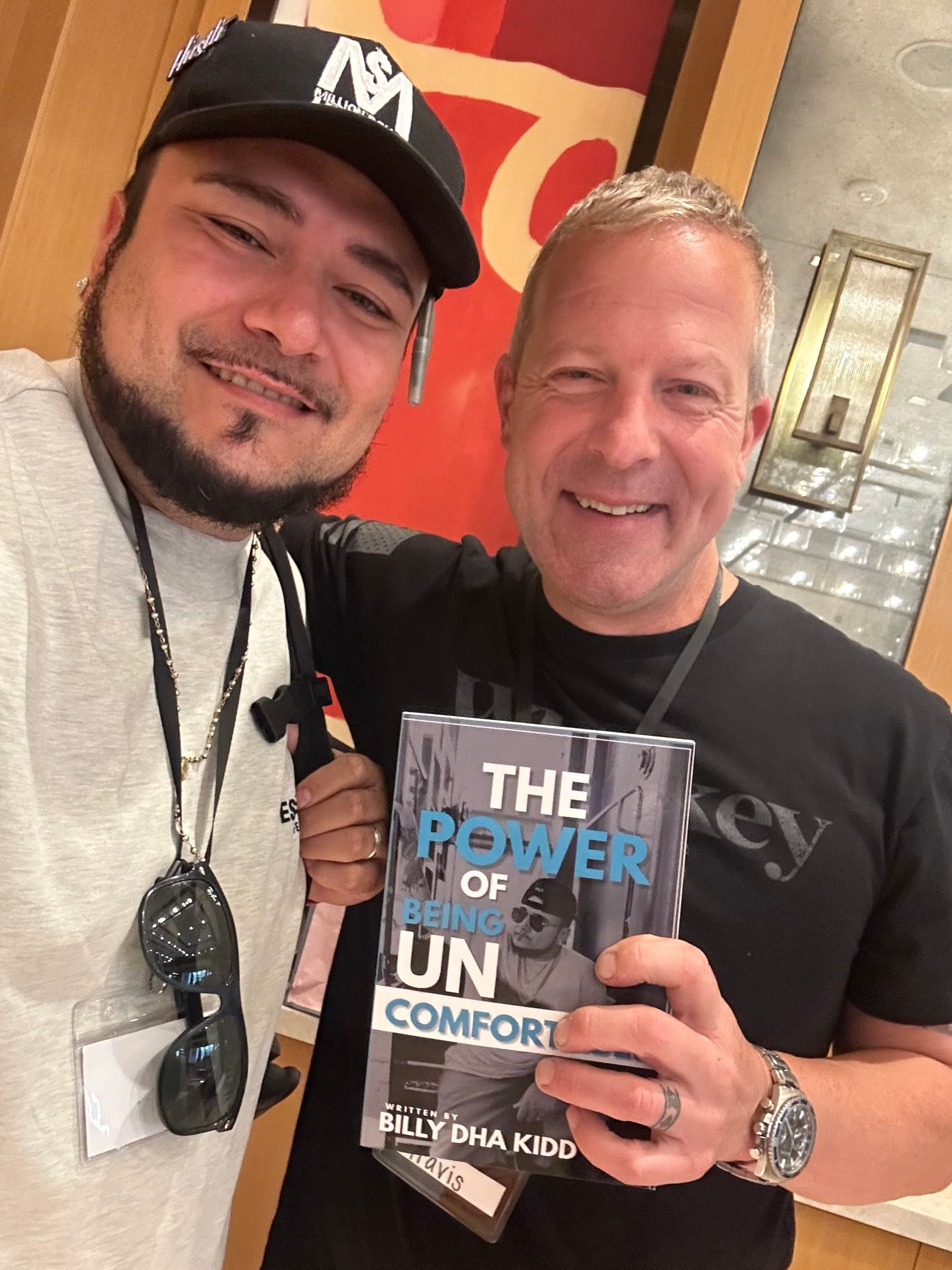 Travis Flateau with Billy Dha Kidd holding The Power of Being Uncomfortable